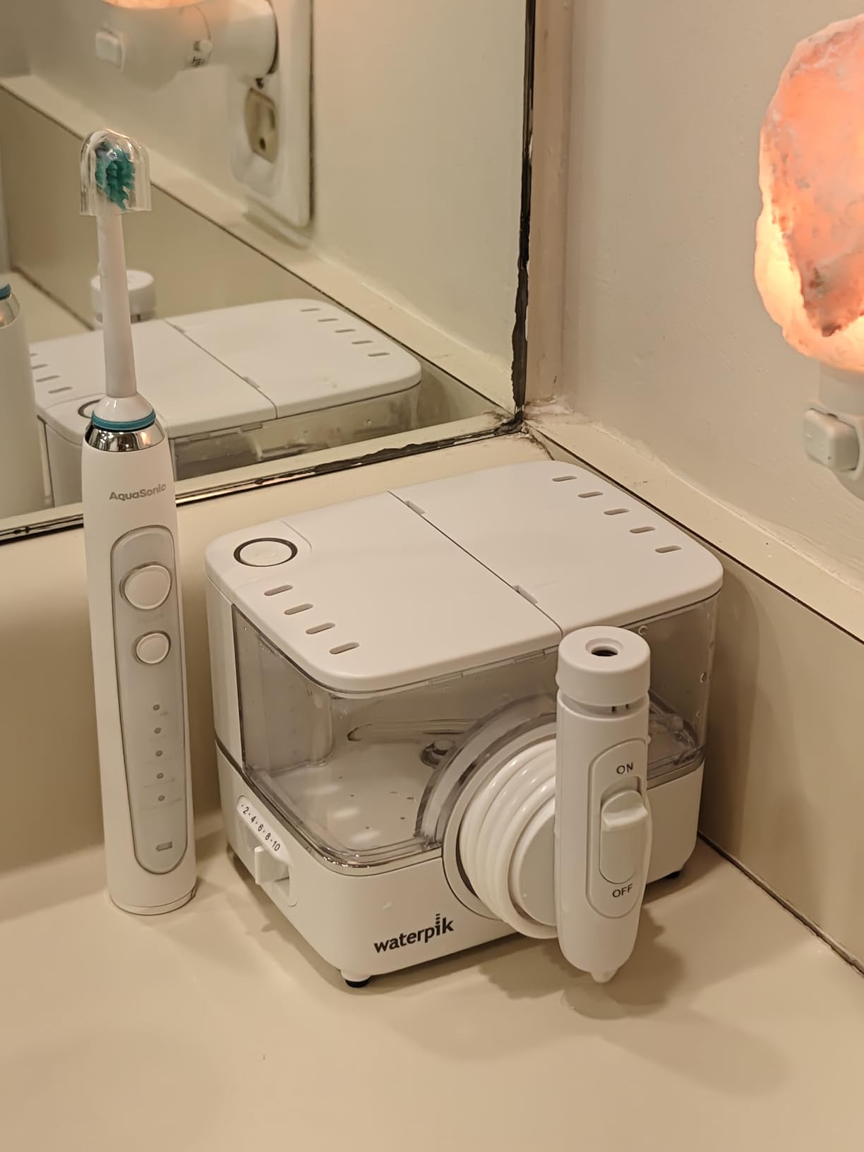 Waterpik ION Rechargeable Water Flosser with 10 Settings, 7 Tips, White | Portable Cordless Countertop for at Home Daily Gum Health, Dental Braces, Implants, ADA Accepted, WF-12 customer photo 1
