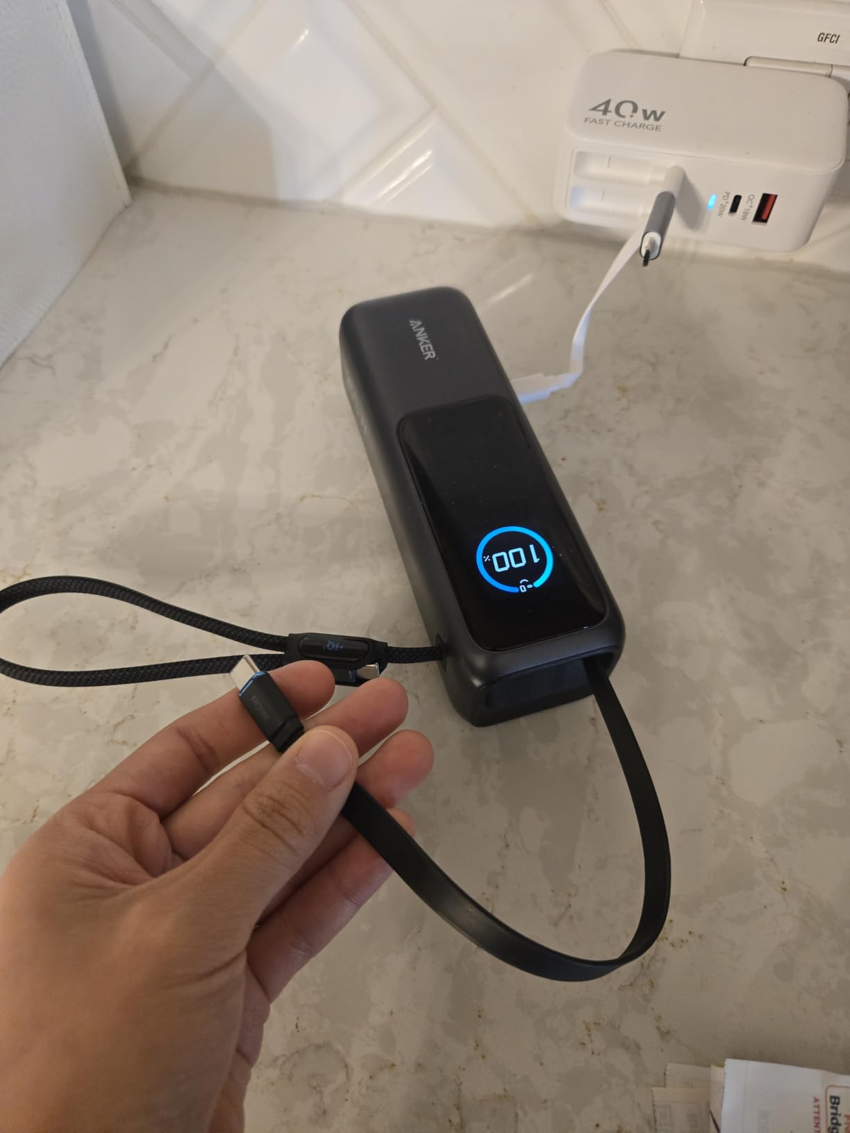 Anker Laptop Power Bank, 25,000mAh Travel Essential with 165W Total Output | 3 USB-C Ports with 100W Max Each, Built-In Retractable Cables, Flight-Ready, for iPhone 17 Series, MacBook, and More customer photo 1
