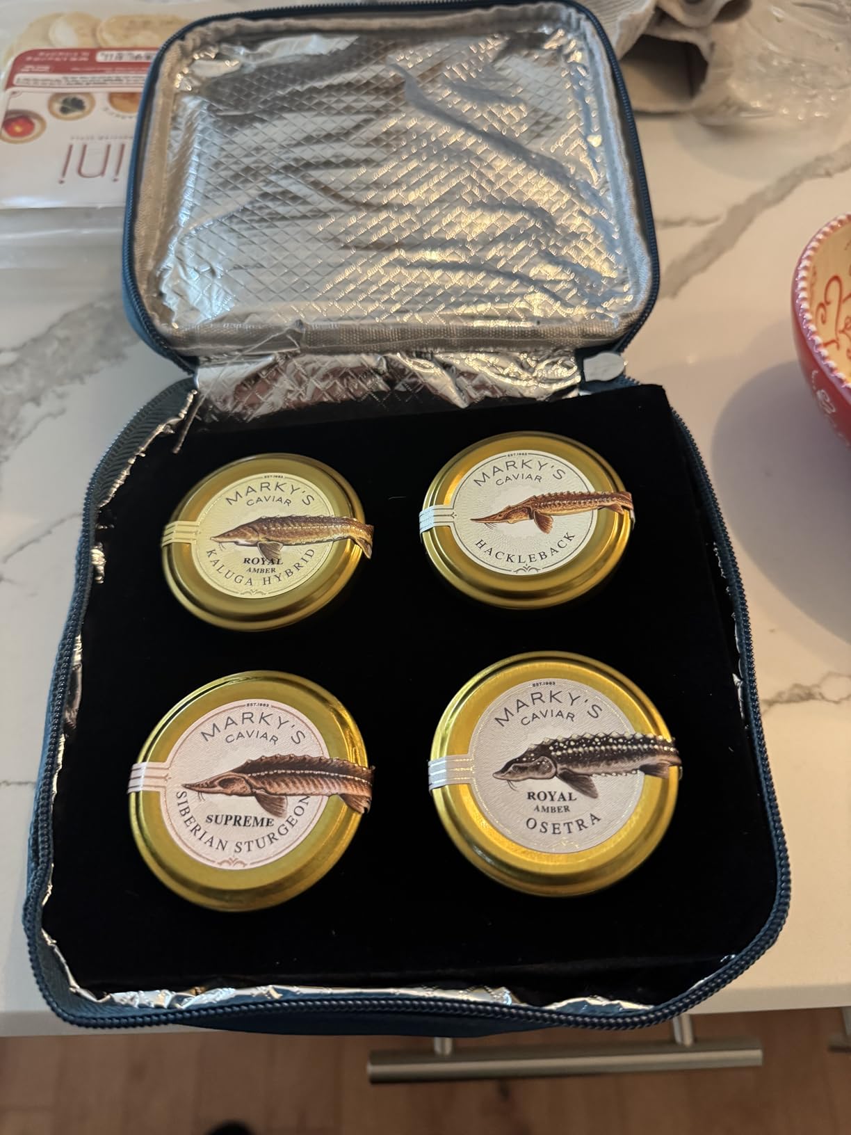 MARKY'S Curated Caviar Tasting Gift Set - 0.5 oz (Pack of 4) x Kaluga Royal Amber, Royal Amber Osetra, Hackleback, Siberian Sturgeon - Caviar Blini, Creme Fraiche, Serving Set, Spoon, Plate & Tin Opener - Cooler Gift Bag customer photo 1
